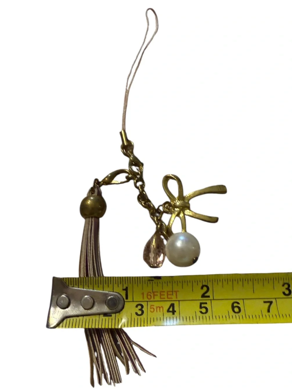 BENEIGE handmade bow and pearl bag charm featuring a gold-toned bow accent